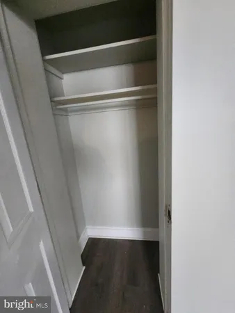 a view of an empty walk in closet