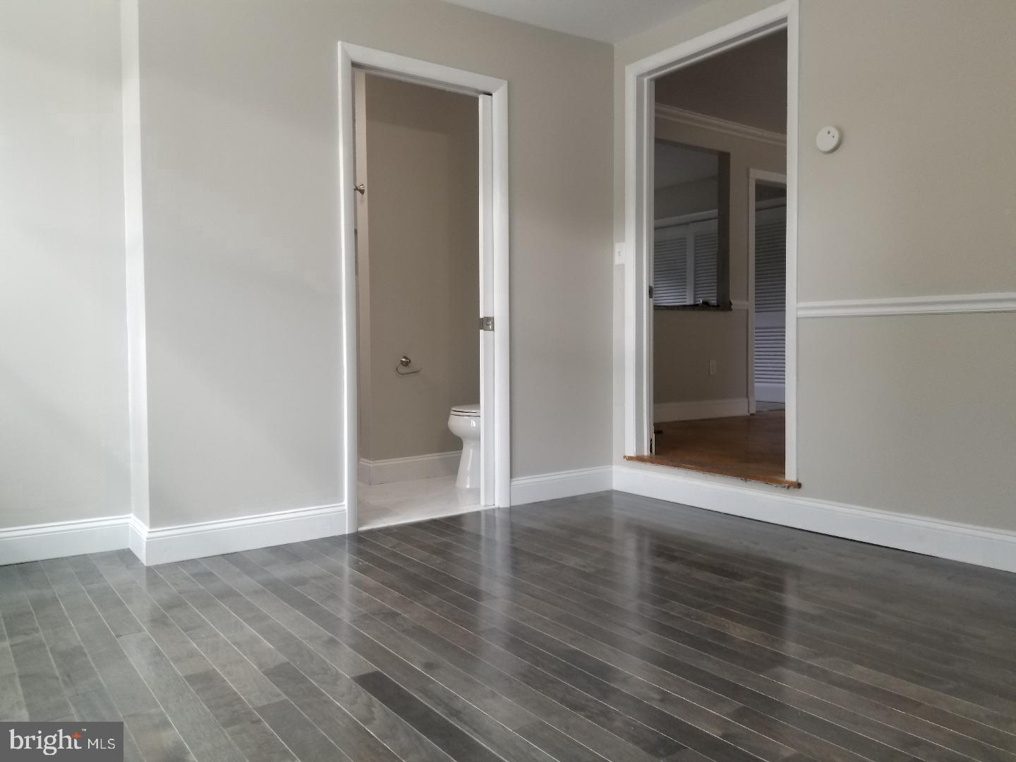 229 Deptford Road Glassboro, NJ 08028 - Photo 5 of 7 a view of wooden floor and windows in a room