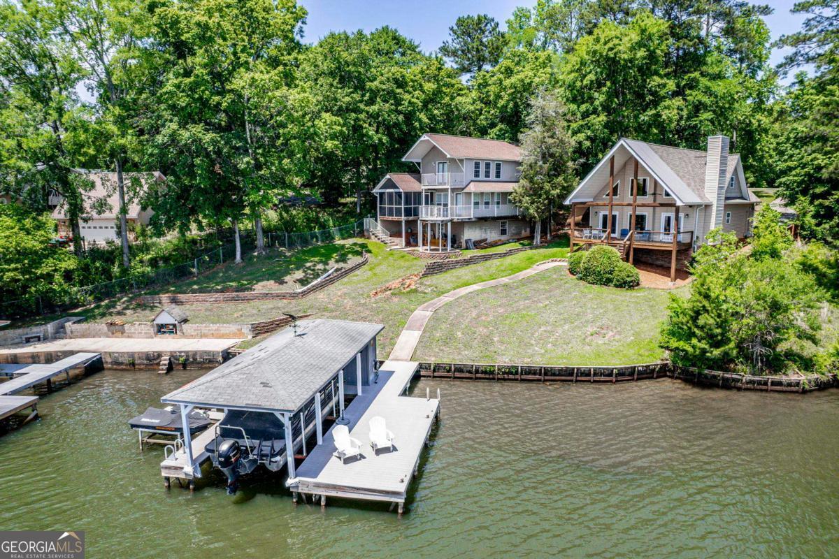 172 Mays Road Milledgeville, GA 31061 - Photo 46 of 54 an aerial view of a house with swimming pool and lake view
