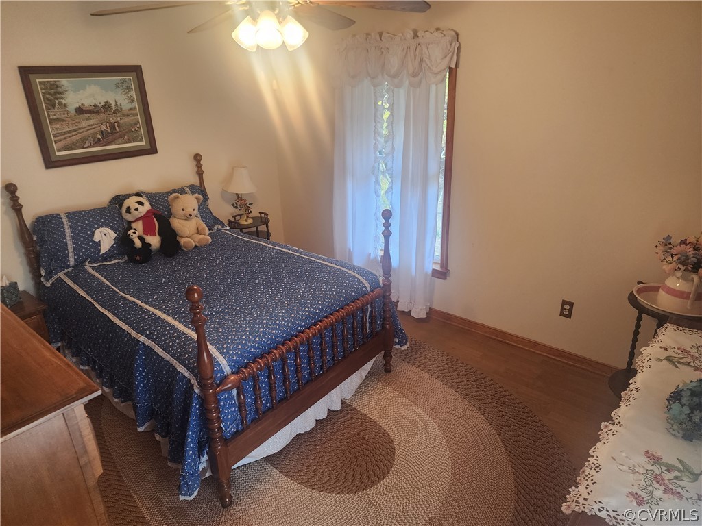 20802 Beaver Dam Road Beaverdam, VA 23015 - Photo 23 of 49 a bedroom with a bed and a chandelier
