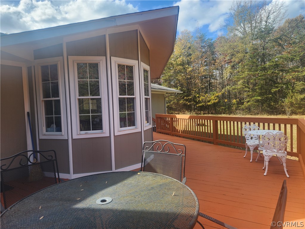 20802 Beaver Dam Road Beaverdam, VA 23015 - Photo 32 of 49 a balcony with table and chairs