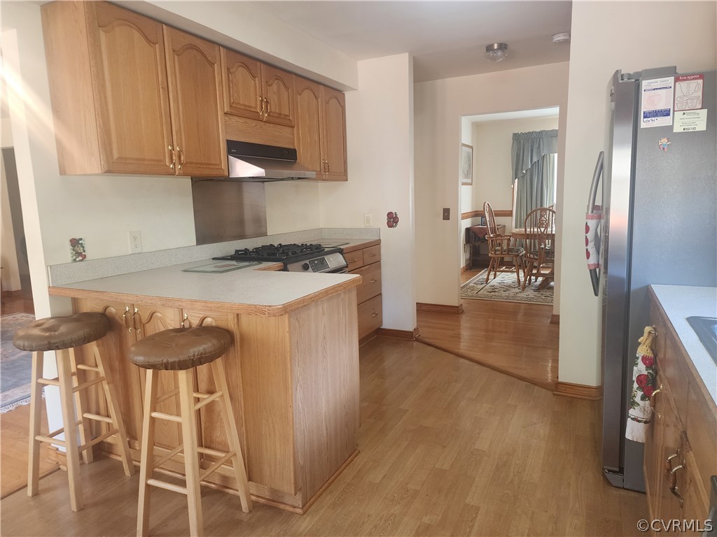 20802 Beaver Dam Road Beaverdam, VA 23015 - Photo 5 of 49 a kitchen with a stove and a refrigerator