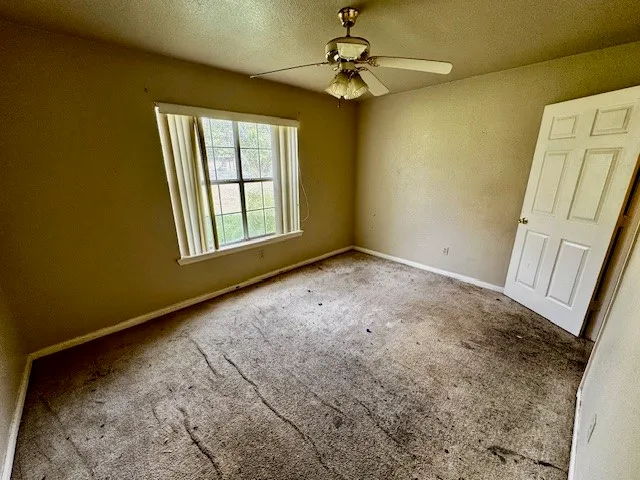 a view of empty room with windows