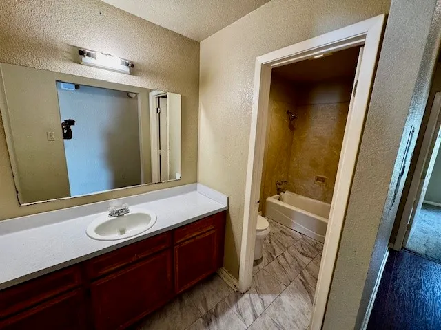 a bathroom with a sink a mirror and a bathtub