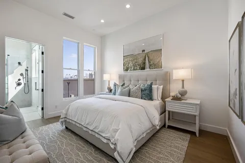 a bedroom with a bed and a couch