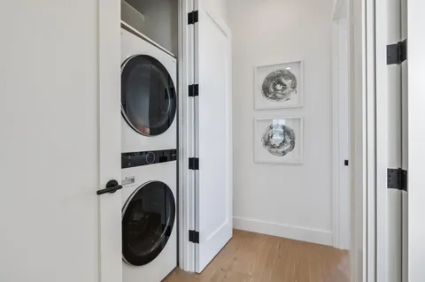 a view of a hallway with washer and dryer