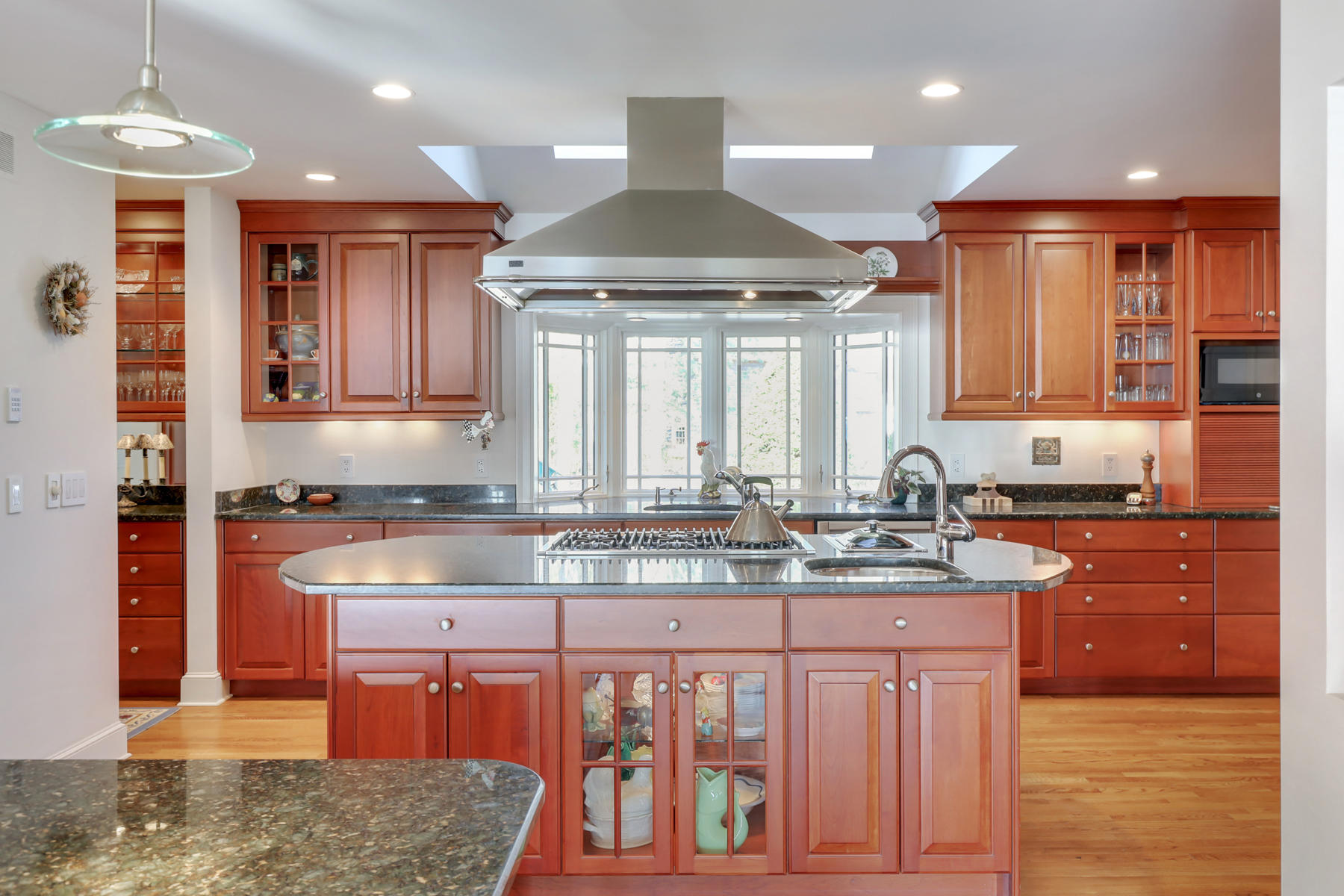 108 Little River Road Cotuit, MA 02635 - Photo 3 of 59 a large kitchen with kitchen island granite countertop a large window