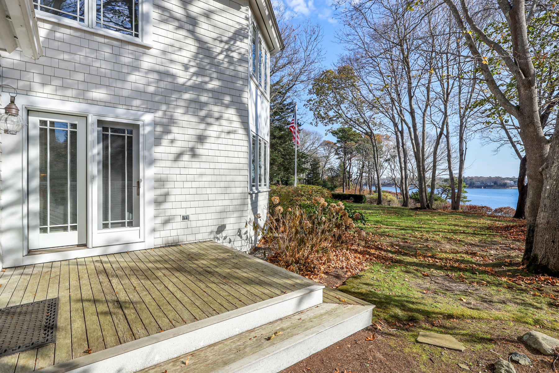 108 Little River Road Cotuit, MA 02635 - Photo 44 of 59 a view of a backyard with large trees