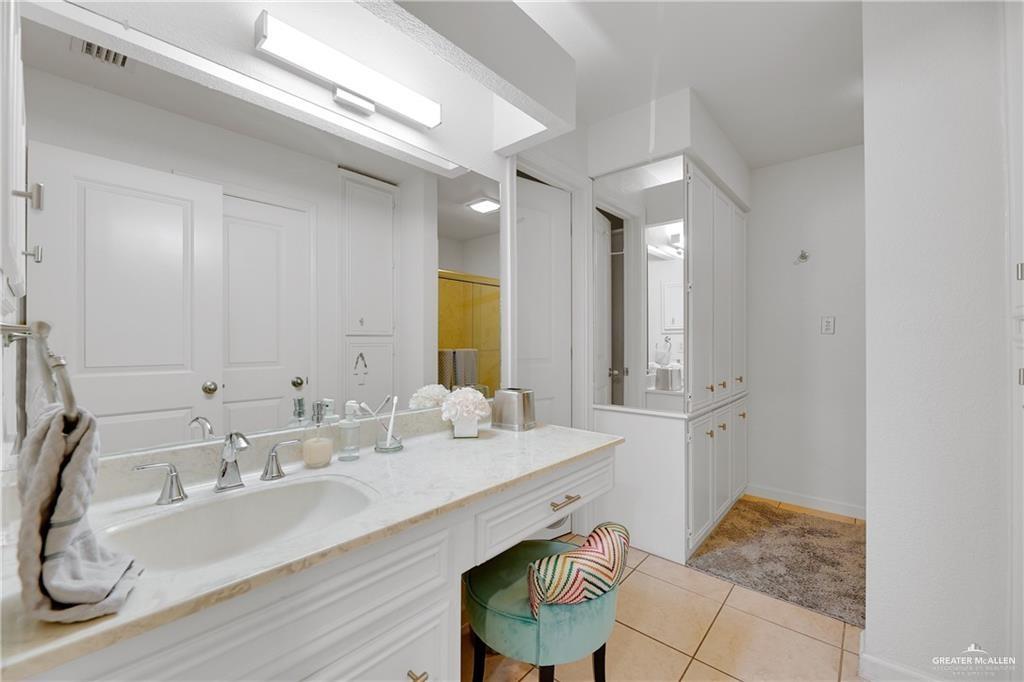 2036 South 5th Street, Unit 8 McAllen, TX 78503 - Photo 15 of 27 a bathroom with a sink and a mirror