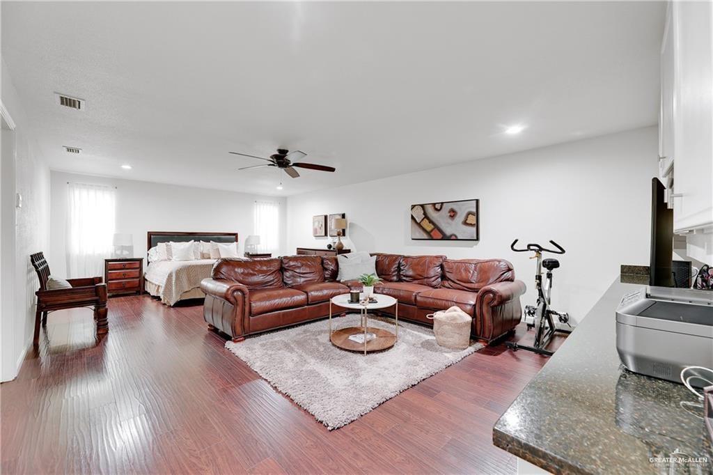 2036 South 5th Street, Unit 8 McAllen, TX 78503 - Photo 18 of 27 a living room with furniture or couch and a wooden floor