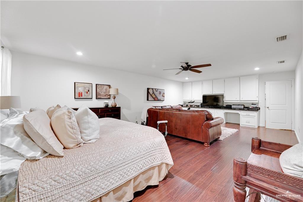 2036 South 5th Street, Unit 8 McAllen, TX 78503 - Photo 19 of 27 a bedroom with two beds and a couch