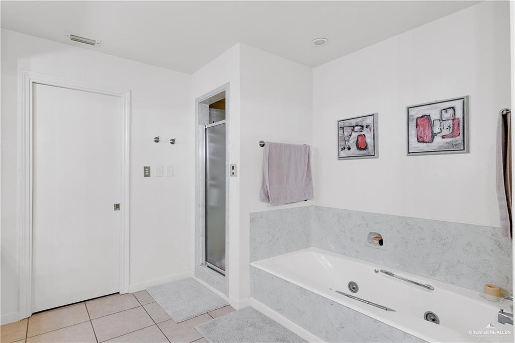 2036 South 5th Street, Unit 8 McAllen, TX 78503 - Photo 21 of 27 a bathroom with a bathtub and shower