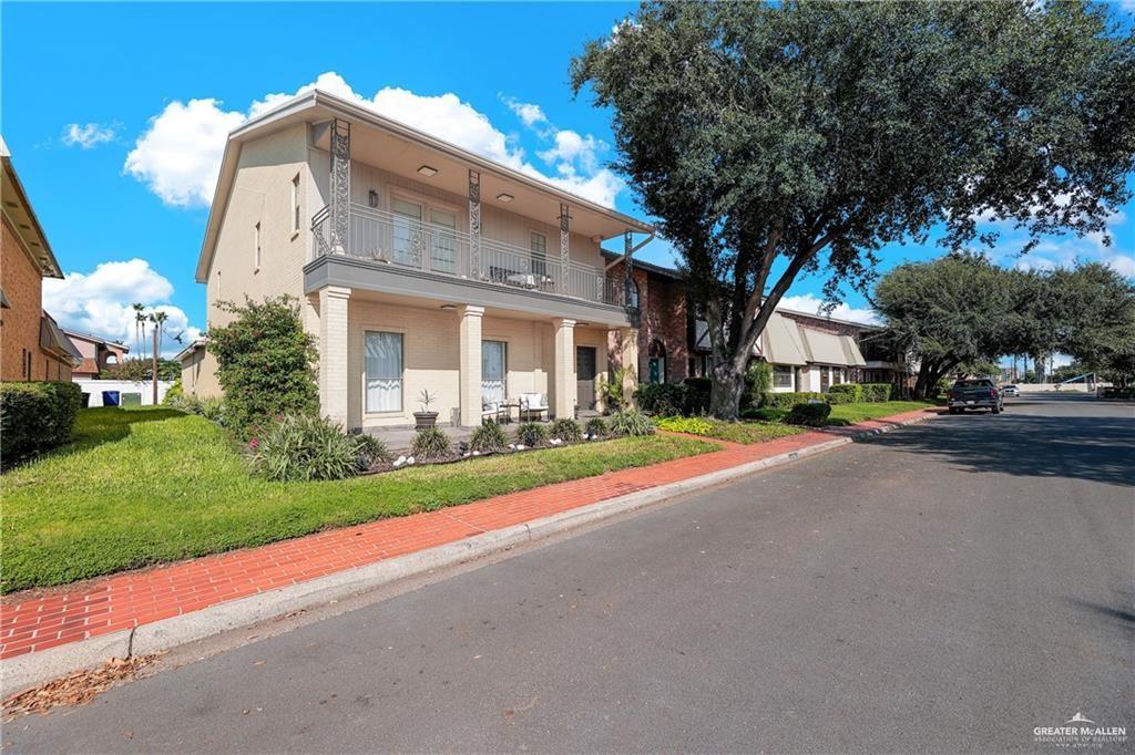 2036 South 5th Street, Unit 8 McAllen, TX 78503 - Photo 3 of 27 a view of a house with a yard and garage