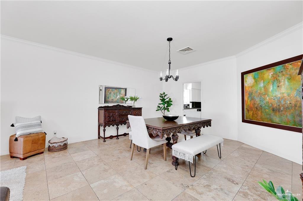 2036 South 5th Street, Unit 8 McAllen, TX 78503 - Photo 6 of 27 a view of a dining room with furniture
