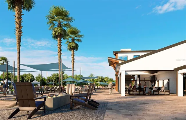 a view of a patio with a table and chairs under an umbrella