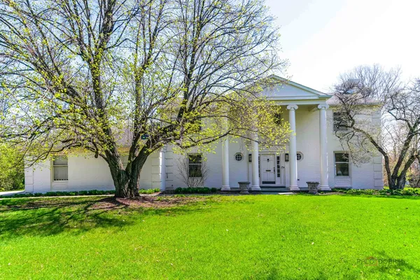 a view of a house with yard and tree s