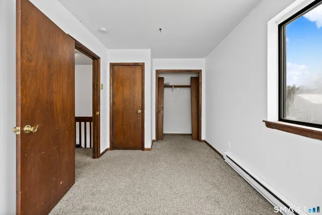 a view of hallway with livingroom