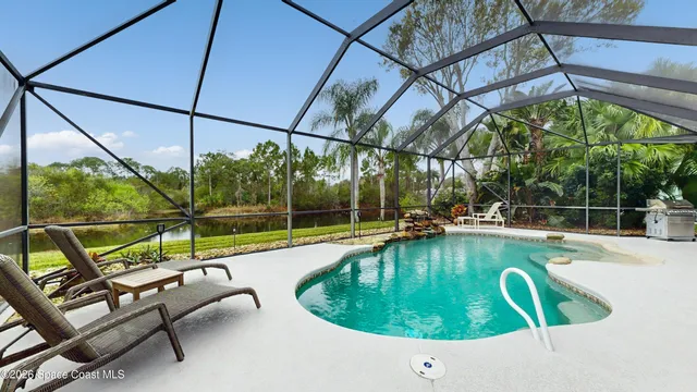 a view of a swimming pool with a patio