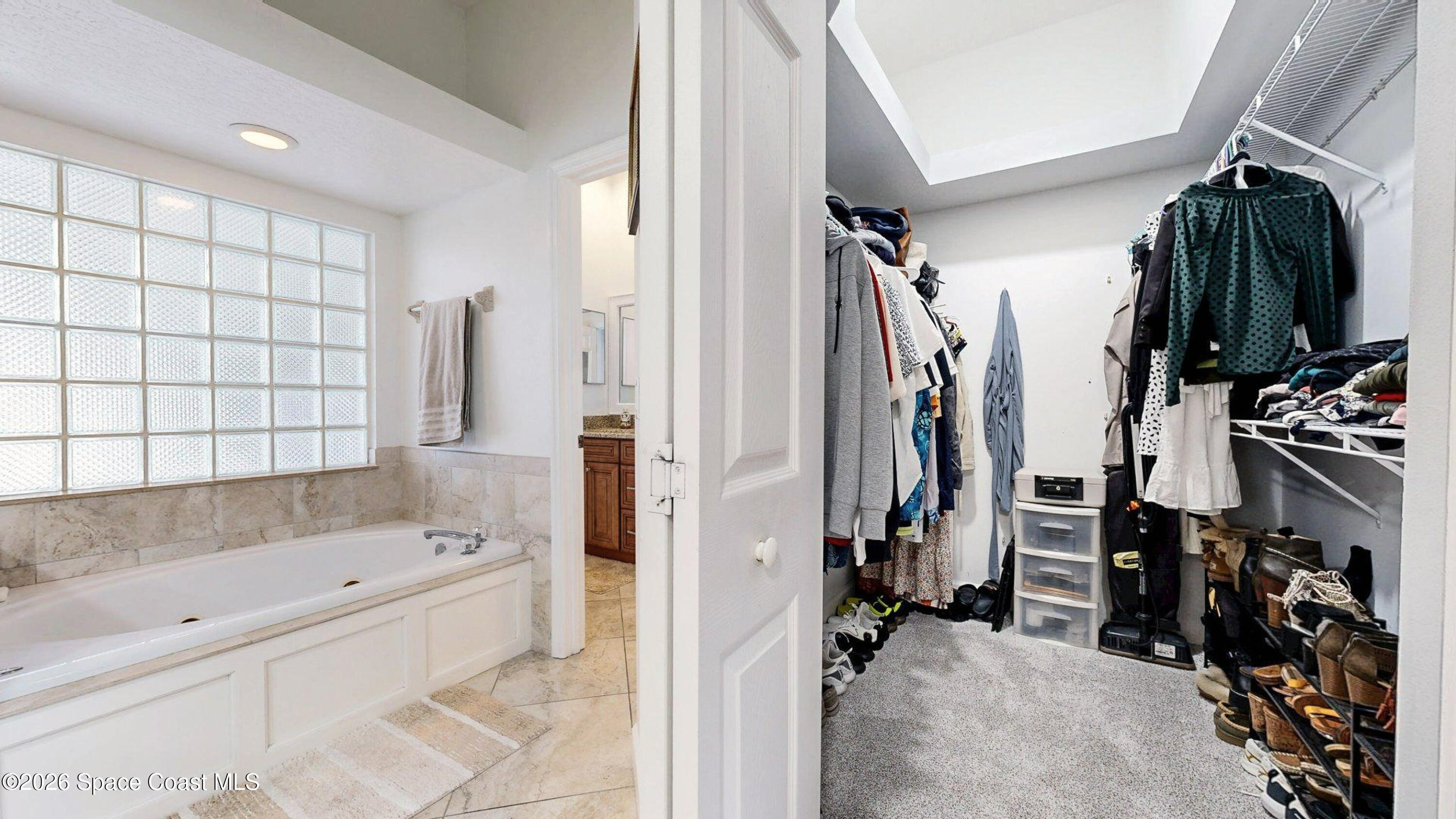 786 Conestee Drive Melbourne, FL 32904 - Photo 16 of 38 a view of walk in closet with clothes and shoes