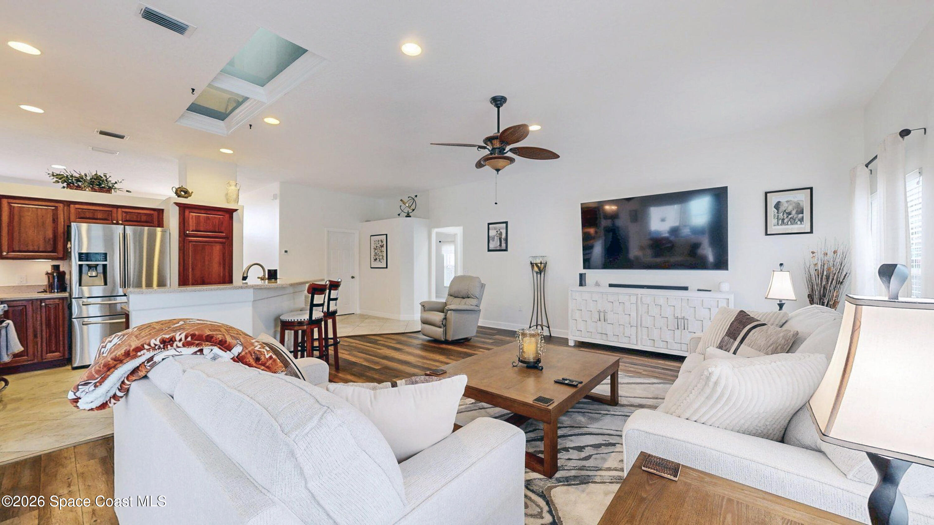 786 Conestee Drive Melbourne, FL 32904 - Photo 3 of 38 a living room with furniture and a flat screen tv