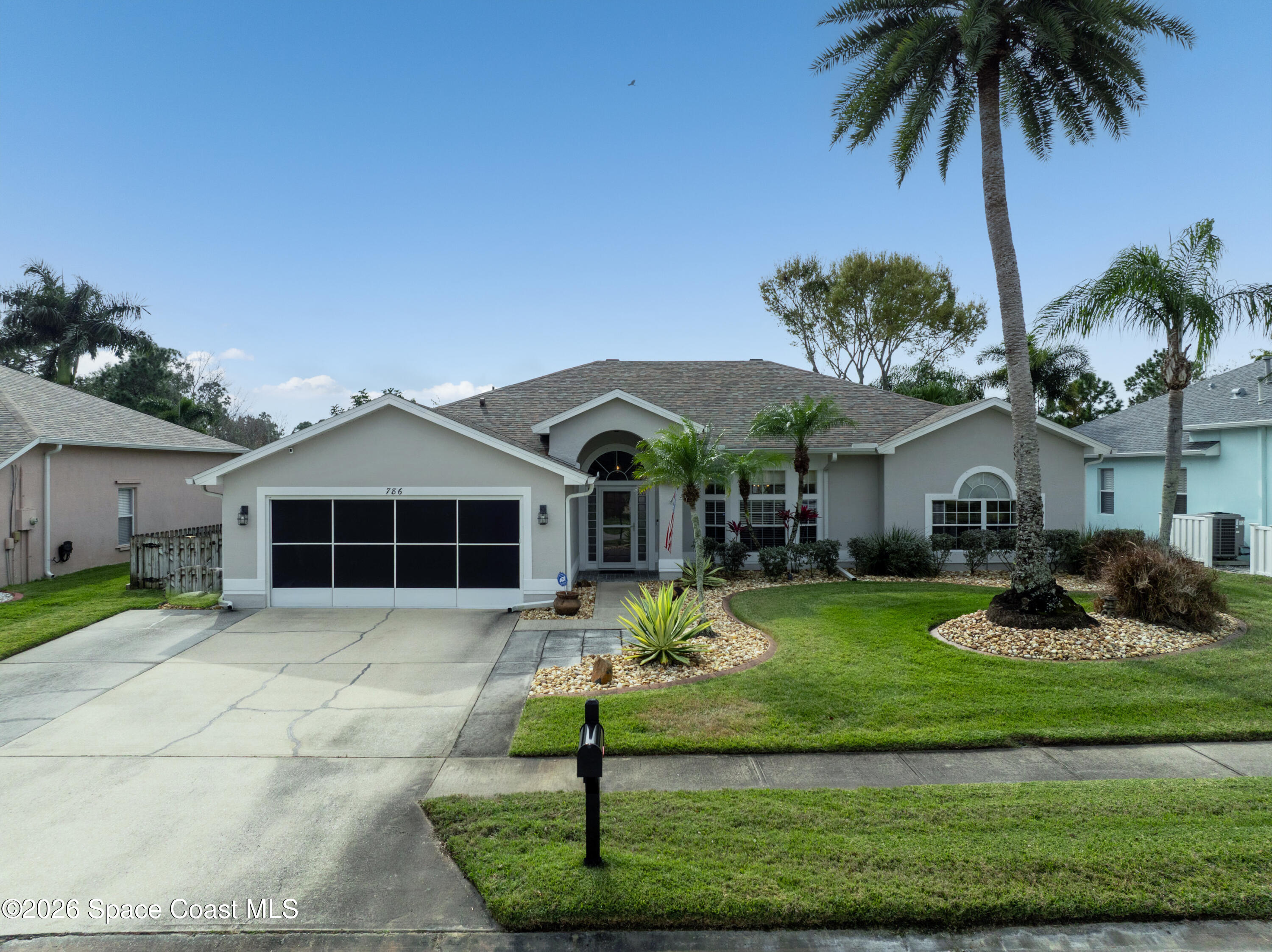 786 Conestee Drive Melbourne, FL 32904 - Photo 33 of 38 a front view of a house with garden