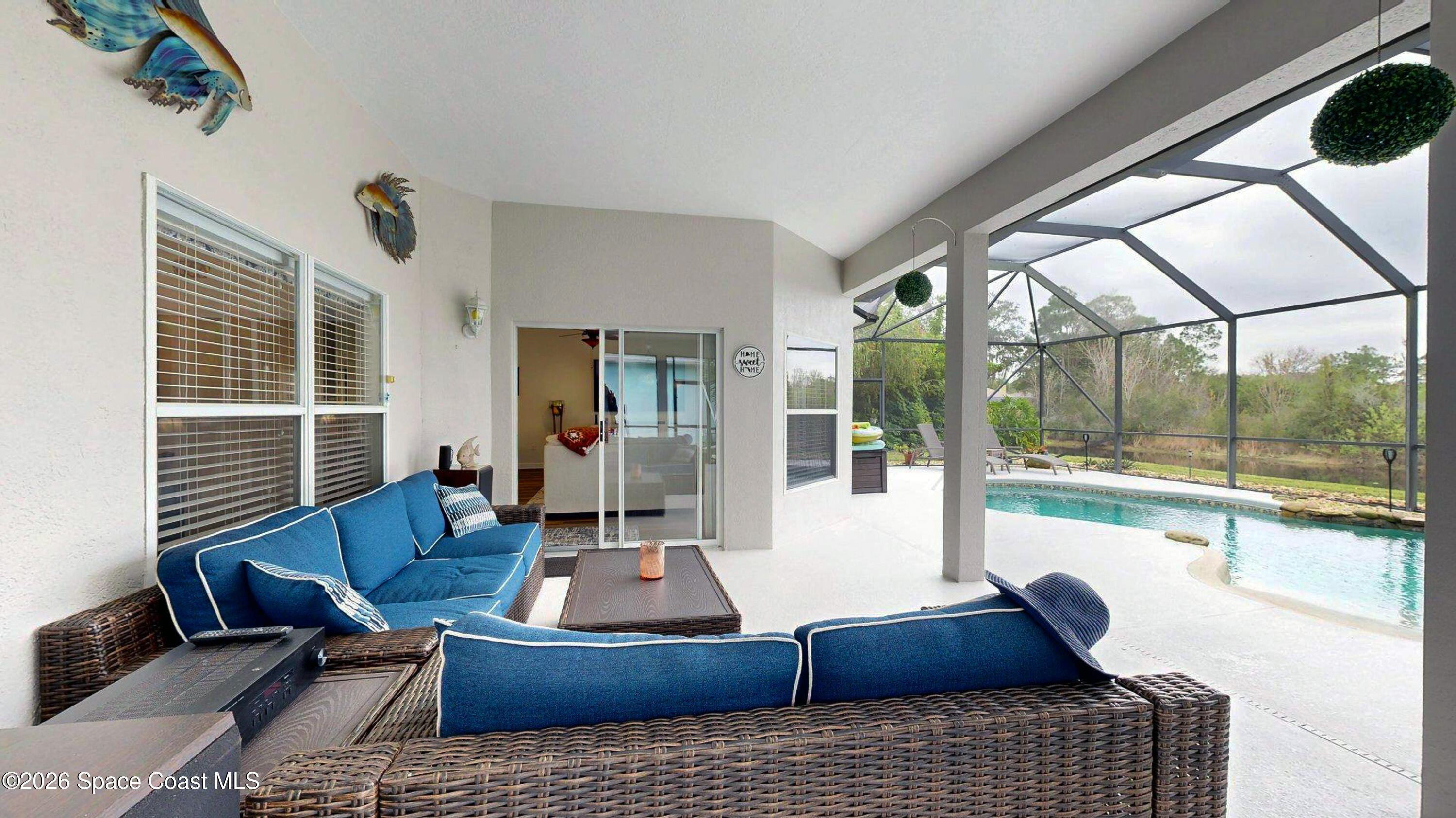 786 Conestee Drive Melbourne, FL 32904 - Photo 34 of 38 a living room with furniture or couch and a large window