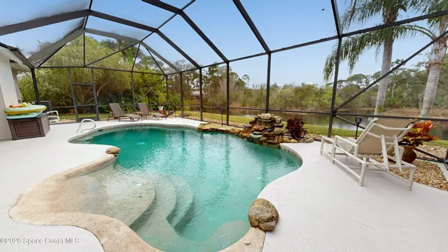 a view of a swimming pool with a patio