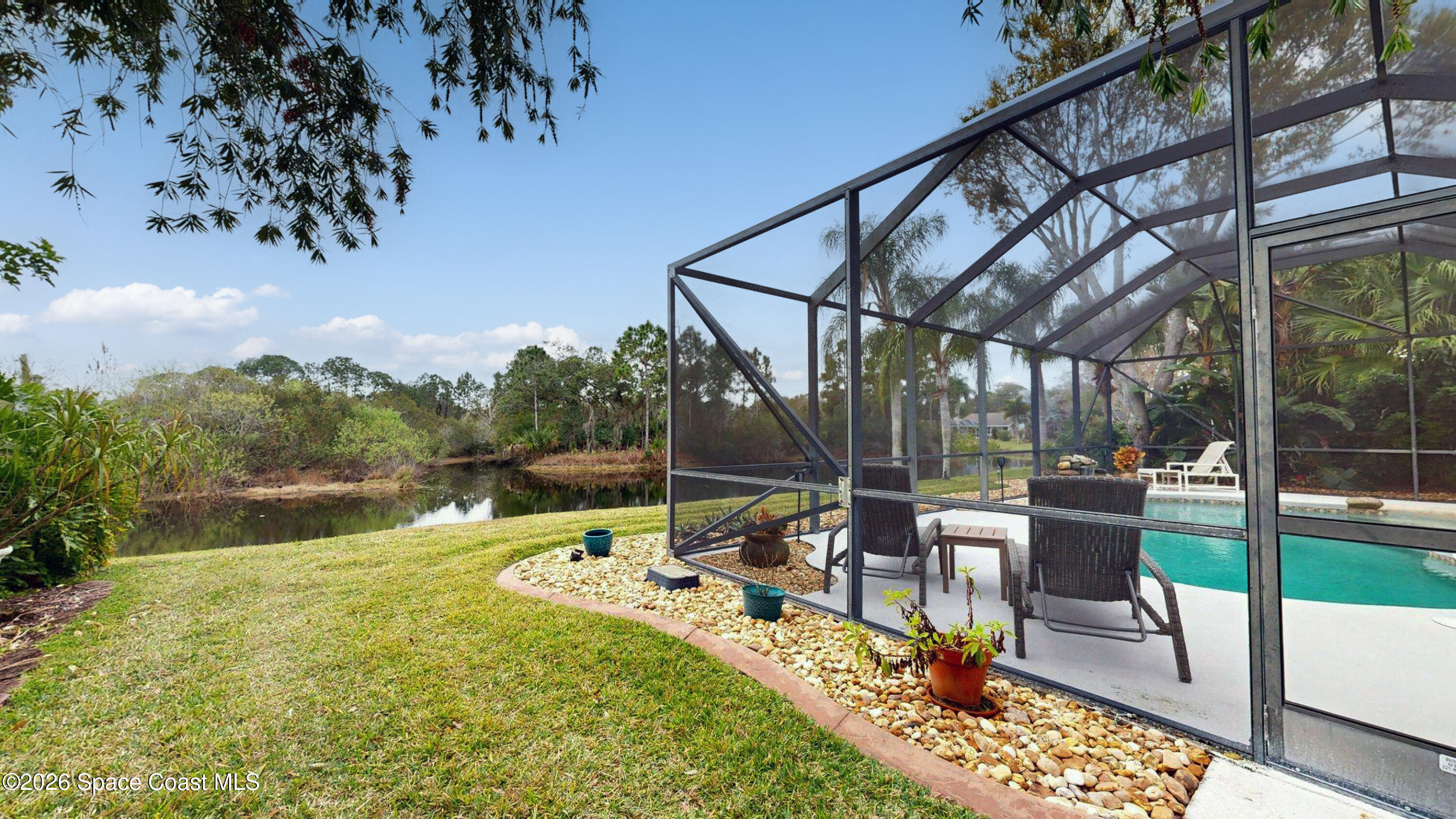 786 Conestee Drive Melbourne, FL 32904 - Photo 36 of 38 a view of a swimming pool with a patio
