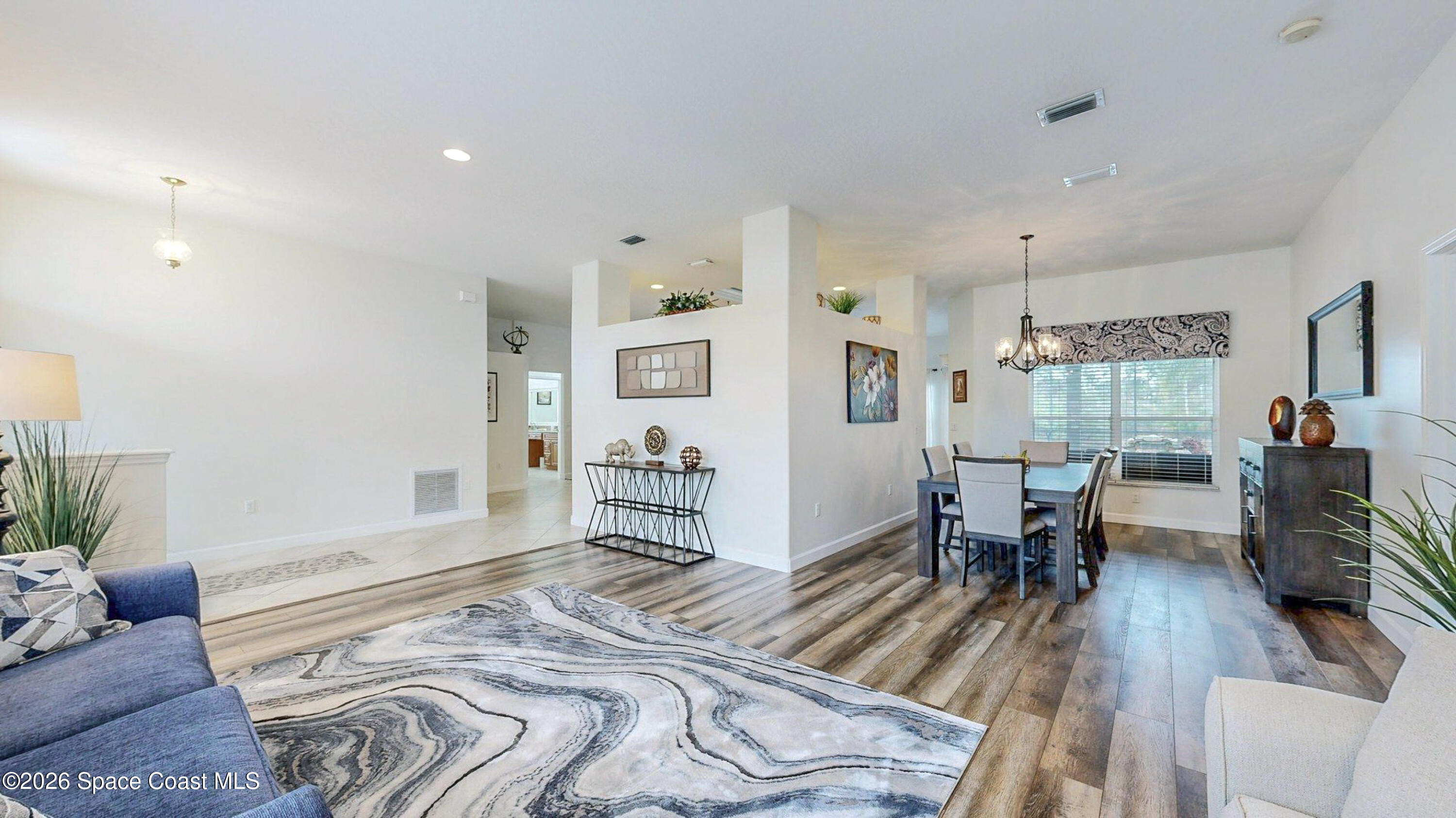 786 Conestee Drive Melbourne, FL 32904 - Photo 5 of 38 a bedroom with furniture and a wooden floor