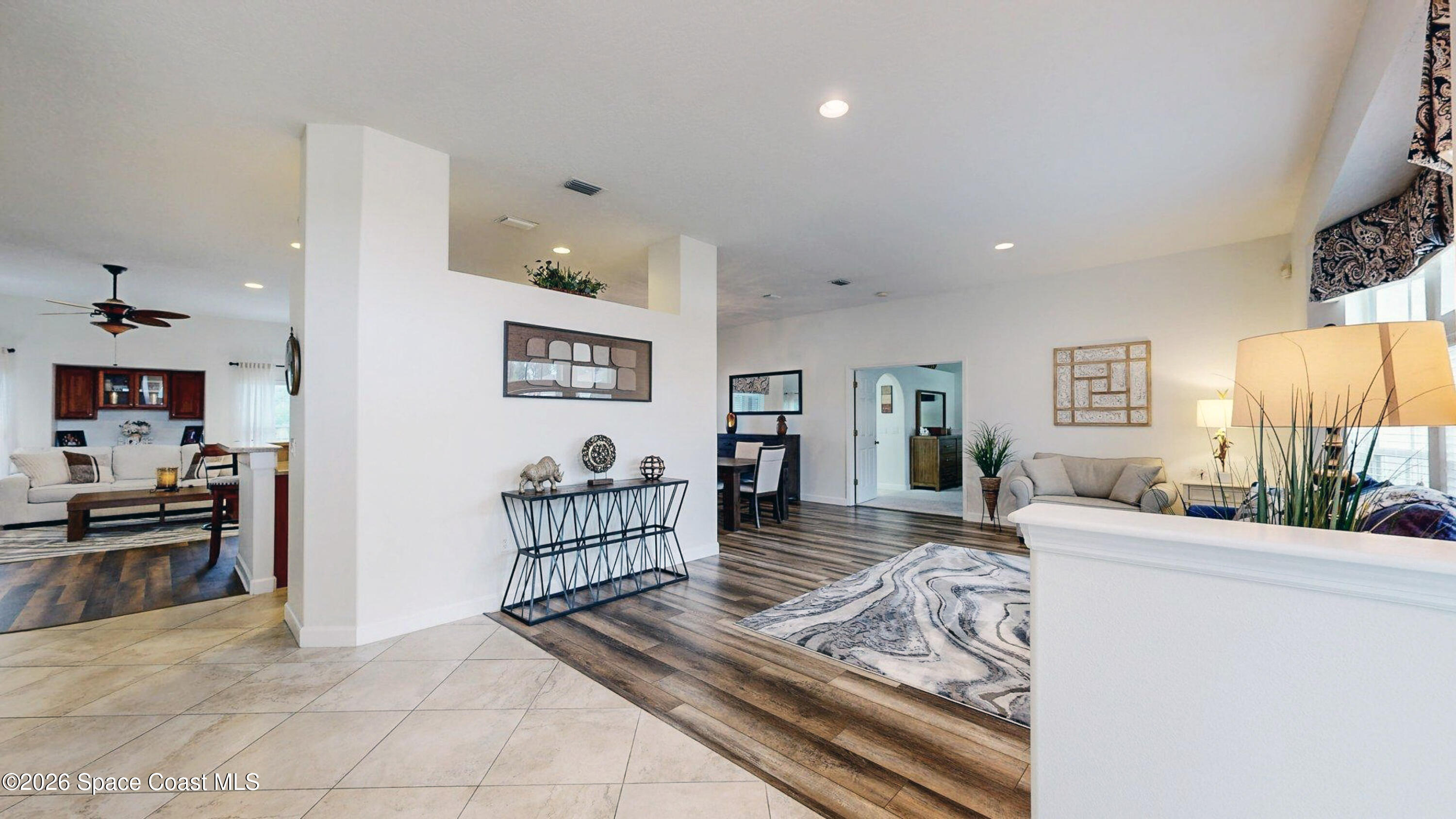 786 Conestee Drive Melbourne, FL 32904 - Photo 6 of 38 a living room with furniture and a flat screen tv