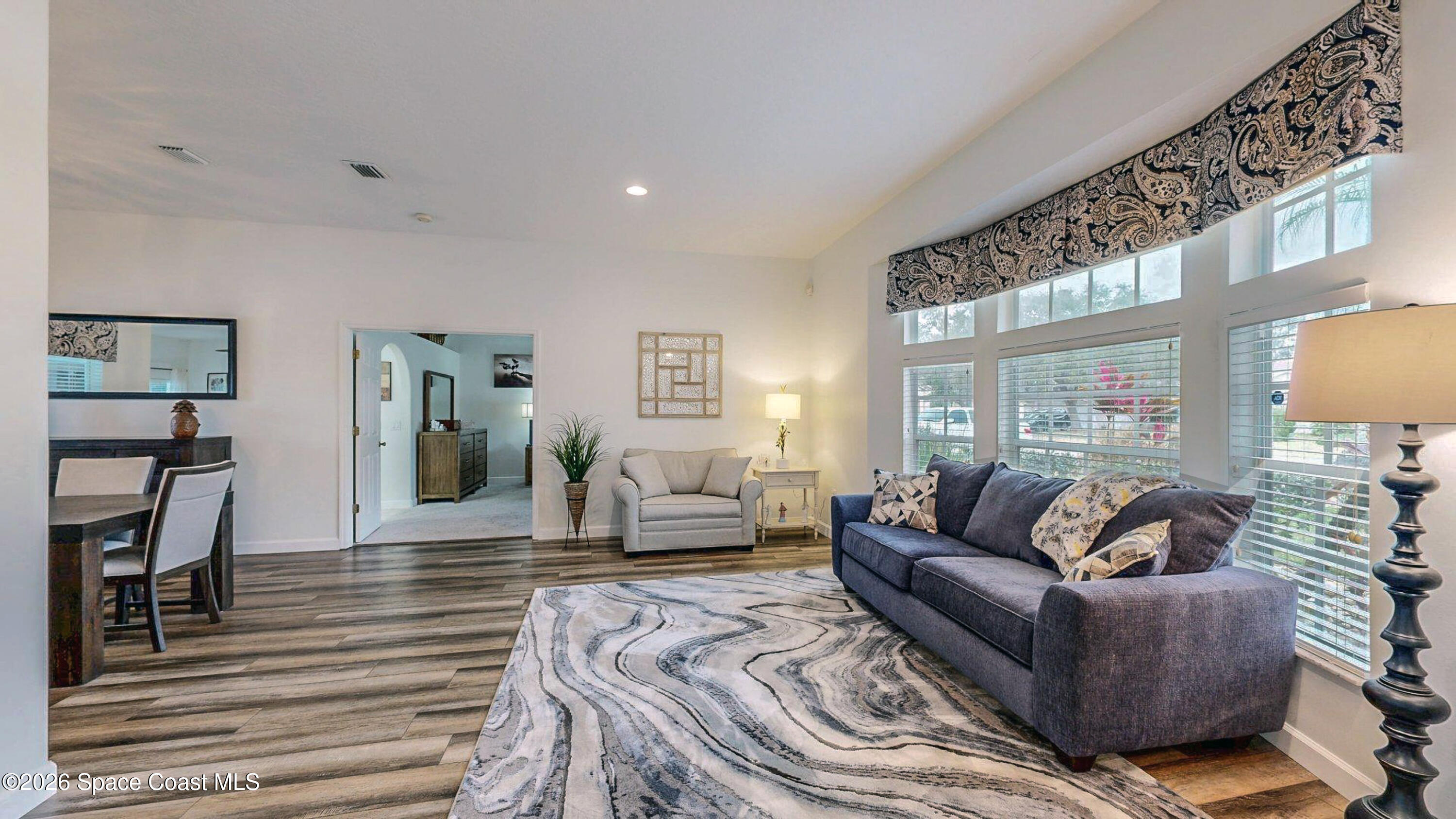 786 Conestee Drive Melbourne, FL 32904 - Photo 10 of 38 a living room with furniture and wooden floor