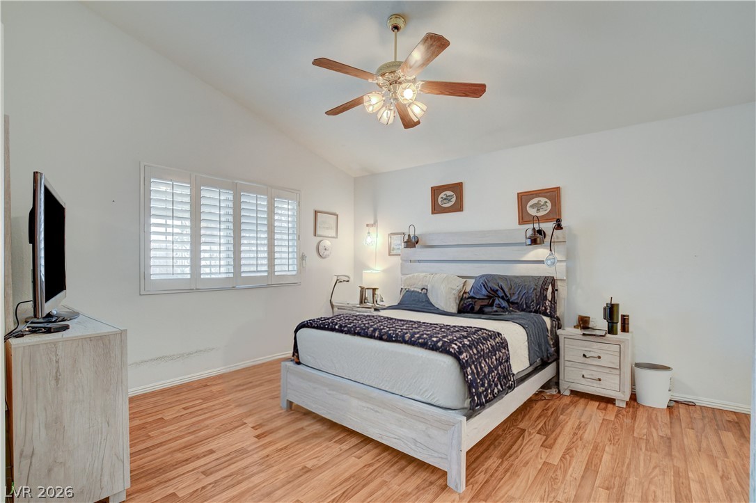 337 Washoe Way Henderson, NV 89074 - Photo 11 of 20 Bedroom with light wood-style floors, ceiling fan, and lofted ceiling