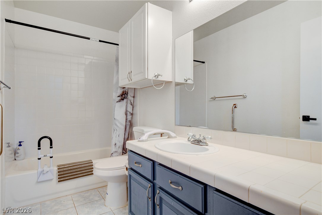 337 Washoe Way Henderson, NV 89074 - Photo 18 of 20 Full bath featuring vanity, shower / bath combo, and light tile patterned floors