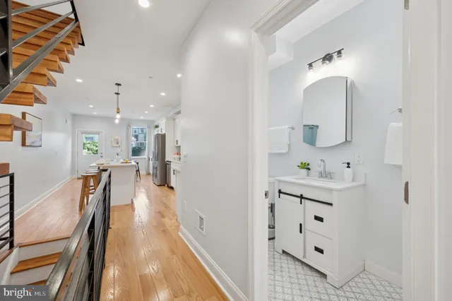 a bathroom with mirror and view