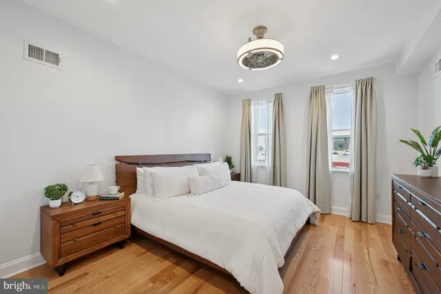 a bed room with a bed and a chandelier