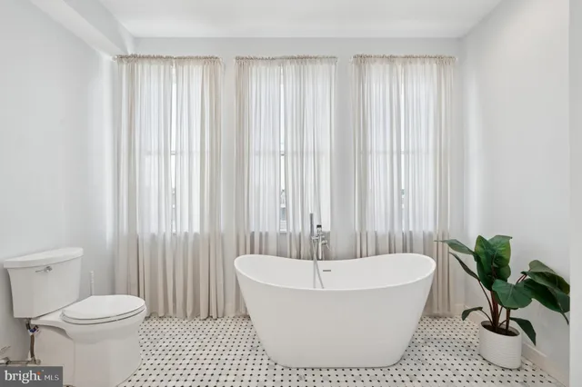 a bathroom with a bathtub and shower