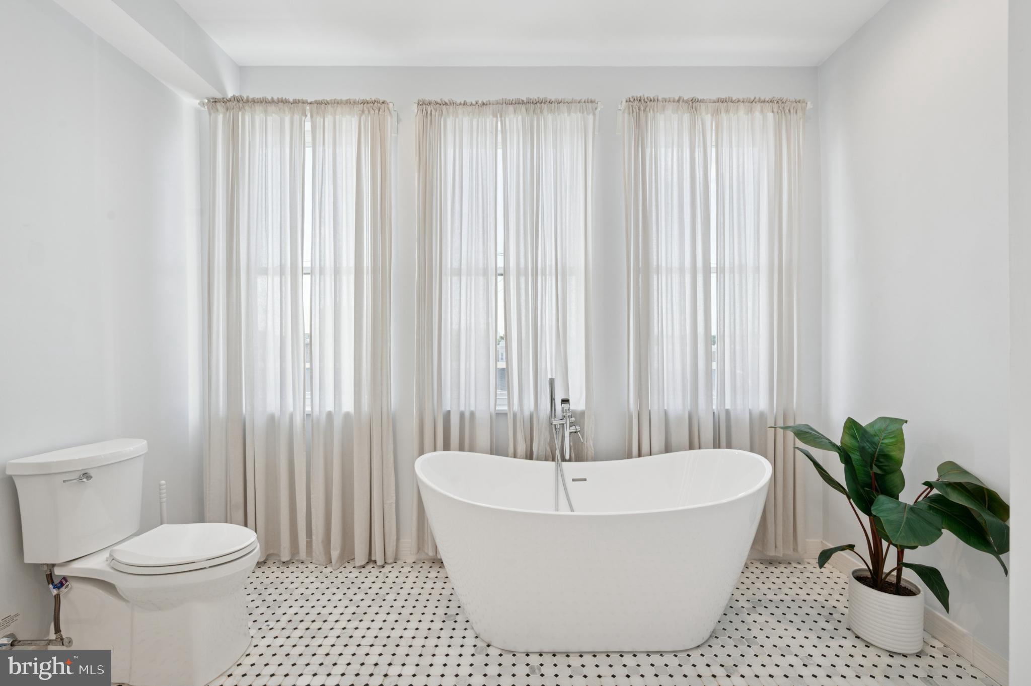 3263 Chatham Street Philadelphia, PA 19134 - Photo 16 of 46 a bathroom with a bathtub and shower