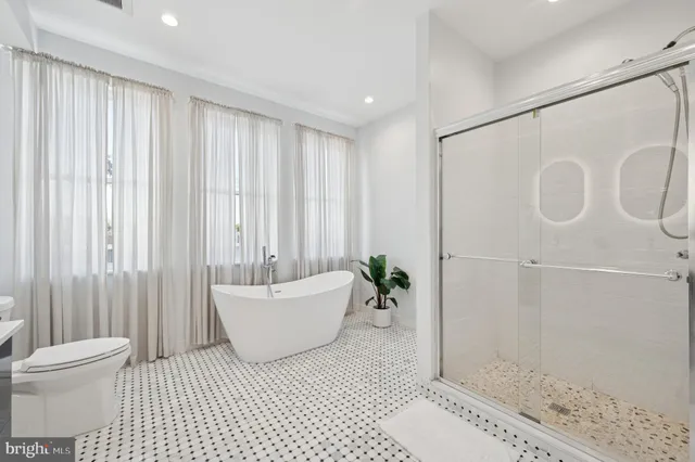 a bathroom with a bathtub and shower