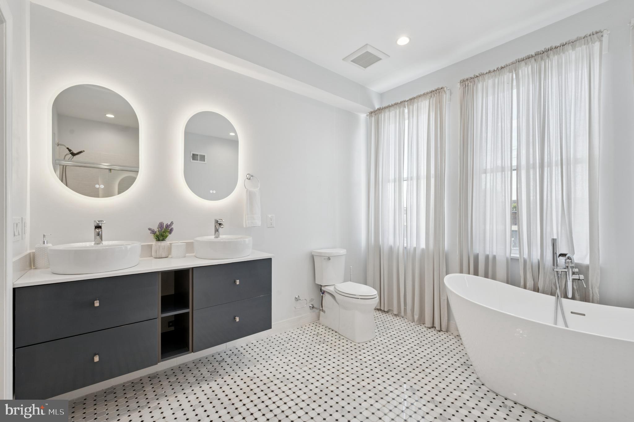 3263 Chatham Street Philadelphia, PA 19134 - Photo 18 of 46 a bathroom with a double vanity sink mirror and toilet