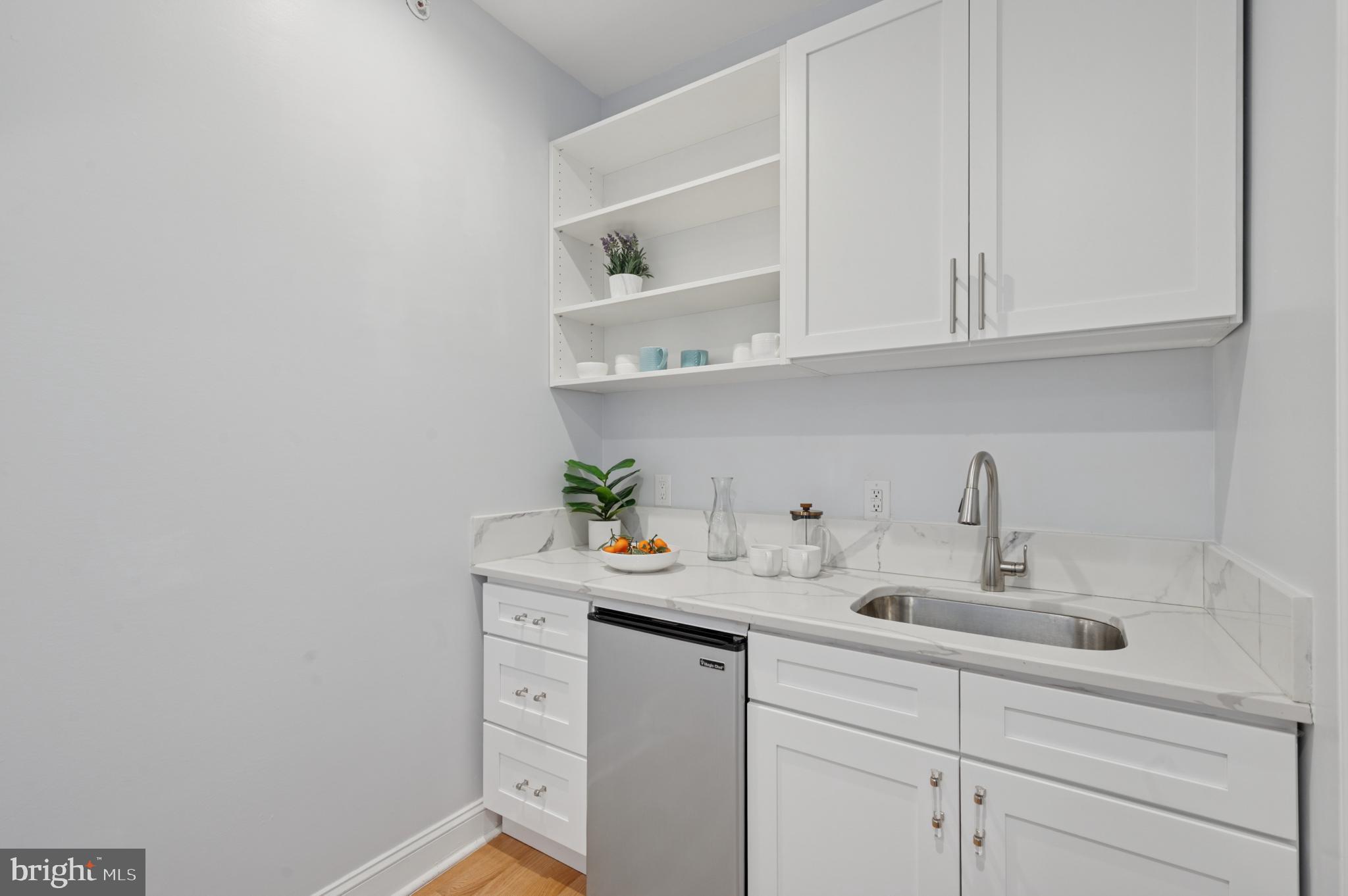 3263 Chatham Street Philadelphia, PA 19134 - Photo 21 of 46 a kitchen with white cabinets and a sink
