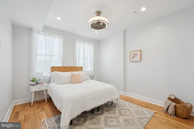 a bedroom with a bed and a table