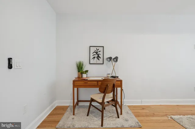 a workspace with furniture and window