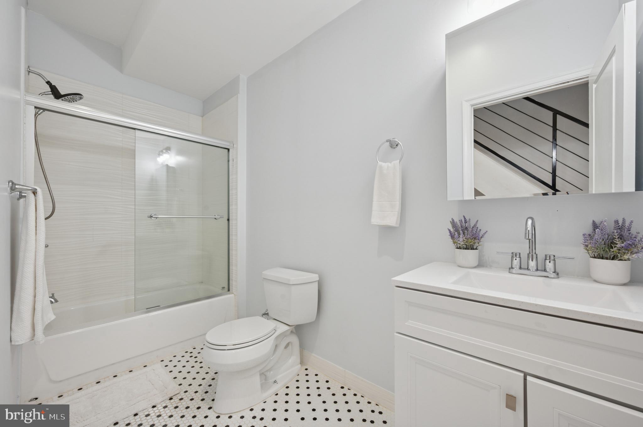 3263 Chatham Street Philadelphia, PA 19134 - Photo 28 of 46 a bathroom with a sink toilet a mirror and shower