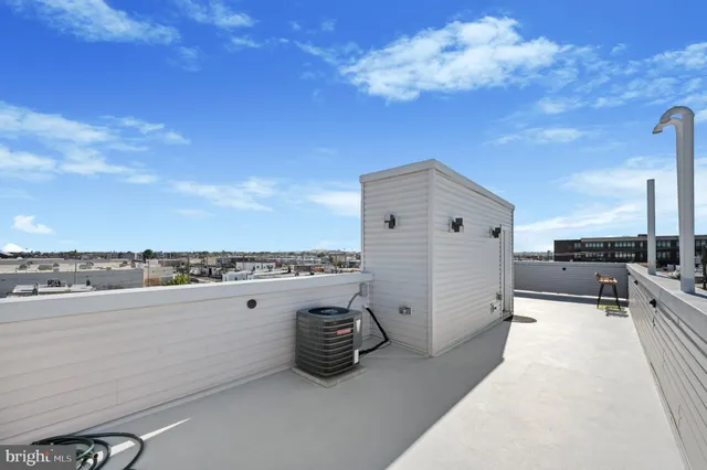 a view of an empty room with kitchen