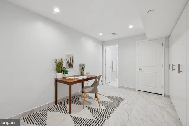 a view of a workspace with furniture