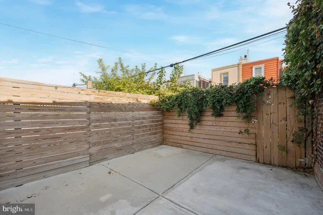 a view of a pathway along the building
