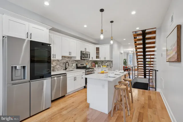 a kitchen with refrigerator and window