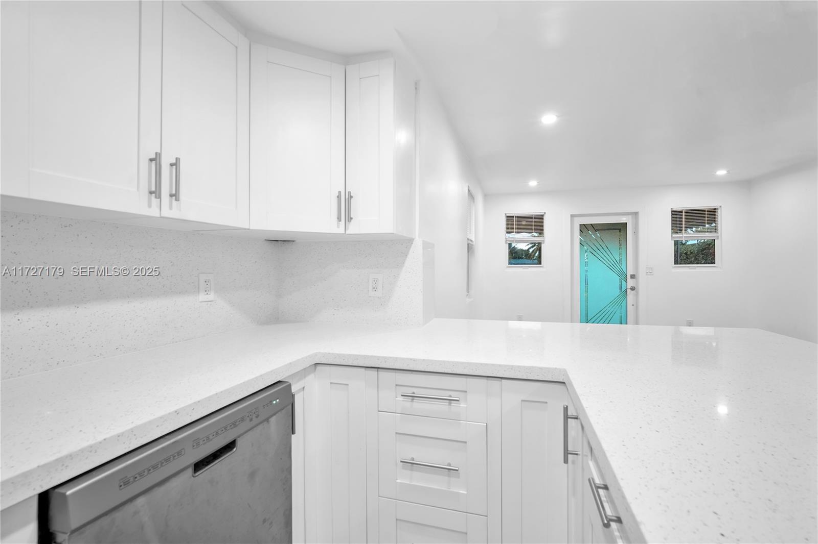 2372 Northwest 34th Street Miami, FL 33142 - Photo 14 of 50 a view of cabinets with wooden floor