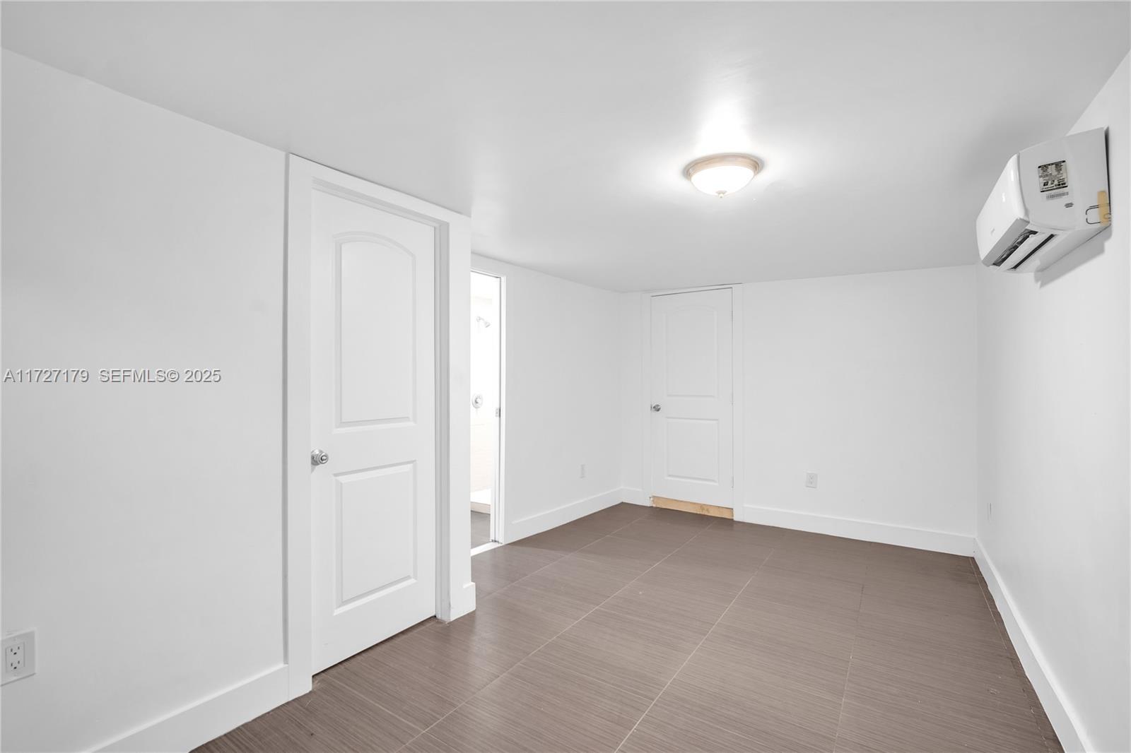 2372 Northwest 34th Street Miami, FL 33142 - Photo 21 of 50 wooden floor in an empty room