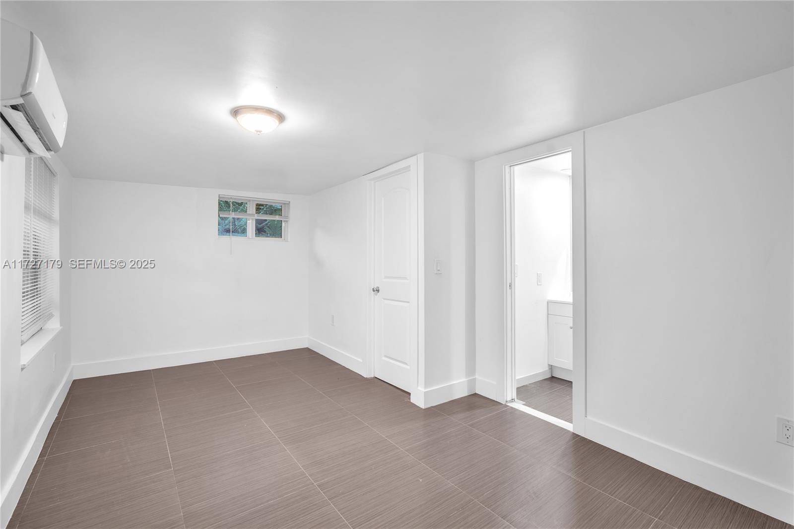 2372 Northwest 34th Street Miami, FL 33142 - Photo 22 of 50 an empty room with a empty space and windows